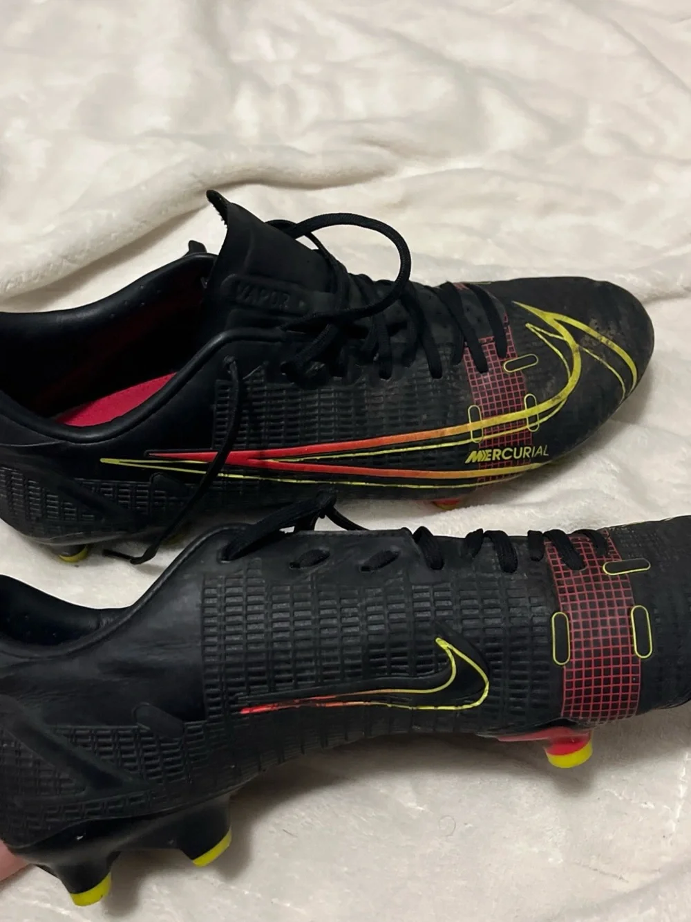 Nike Men's Black Soccer Cleats with Yellow and Red Accents